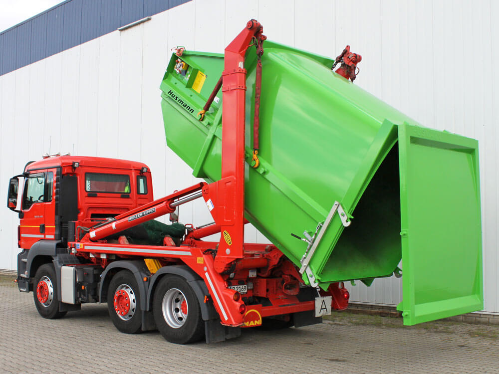 Container cu auto-presare pentru transport pe camion